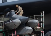 An Airman assigned to the 5th Aircraft Maintenance Group loads AGM-86 air-launched cruise missiles onto a B-52H Stratofortress during Prairie Vigilance 24-3 at Minot Air Force Base, North Dakota, April 6, 2024. Exercises like Prairie Vigilance enable crews to maintain a high state of readiness and proficiency, while validating the always-ready, global strike capability. (U.S. Air Force photo by Airman 1st Class Kyle Wilson)