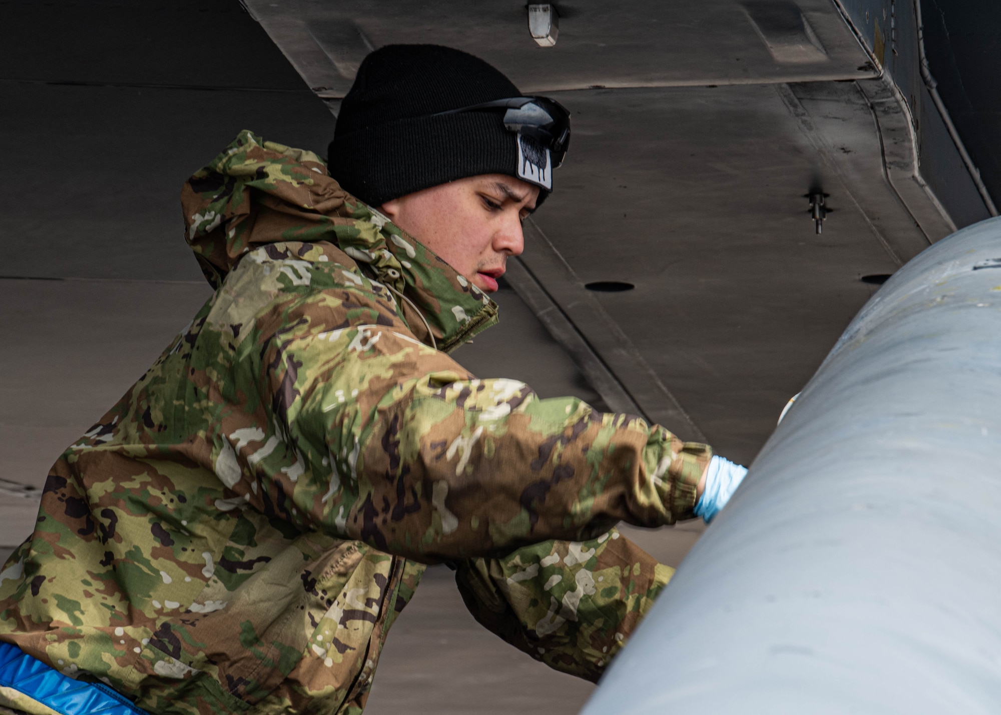 An Airman assigned to the 2nd Maintenance Group loads AGM-86 air-launched cruise missiles onto a B-52H Stratofortress during Prairie Vigilance 24-3 at Minot Air Force Base, North Dakota, April 7, 2024. Exercises like Prairie Vigilance enable crews to maintain a high state of readiness and proficiency, while validating the always-ready, global strike capability. (U.S. Air Force photo by Airman 1st Class Kyle Wilson)
