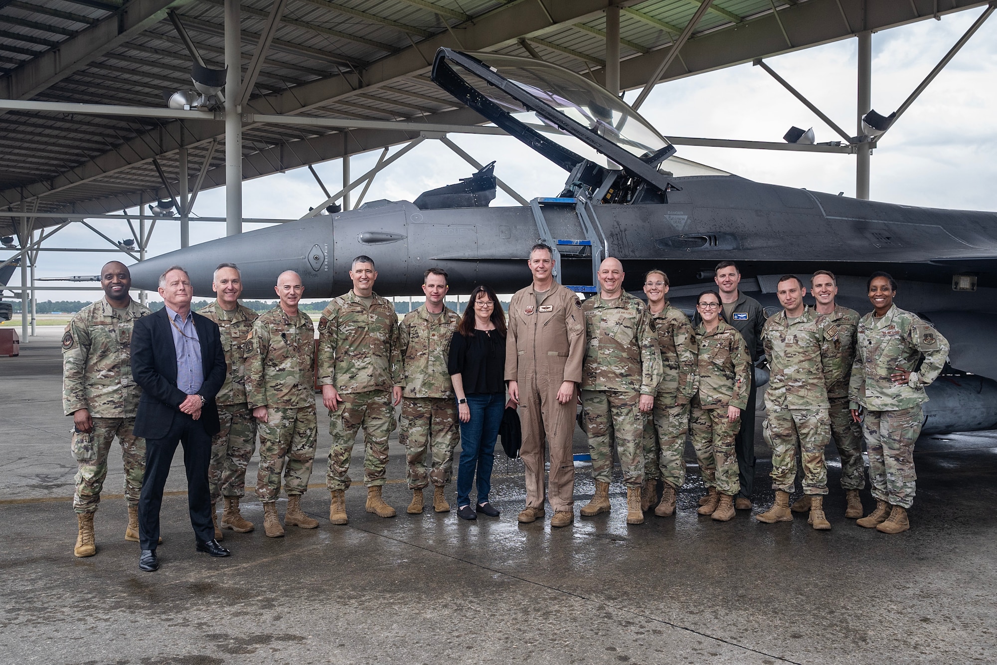 Lt. Gen. Grynkewich, center right, 9th AF (AFCENT) commander, and his spouse, Shannon Grynkewich, center left, pose for a group photo with AFCENT Airmen and senior leaders during Gen. Grynkewich’s final flight as the AFCENT commander.