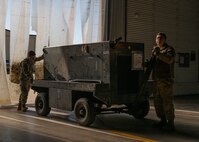 Airmen assigned to the 5th Logistics Readiness Squadron transport equipment during Prairie Vigilance 24-3 at Minot Air Force Base, North Dakota, April 9, 2024. Exercises such as Prairie Vigilance ensure Airmen stay proficient in a variety of key operational skills. (U.S. Air Force photo by Airman 1st Class Kyle Wilson)