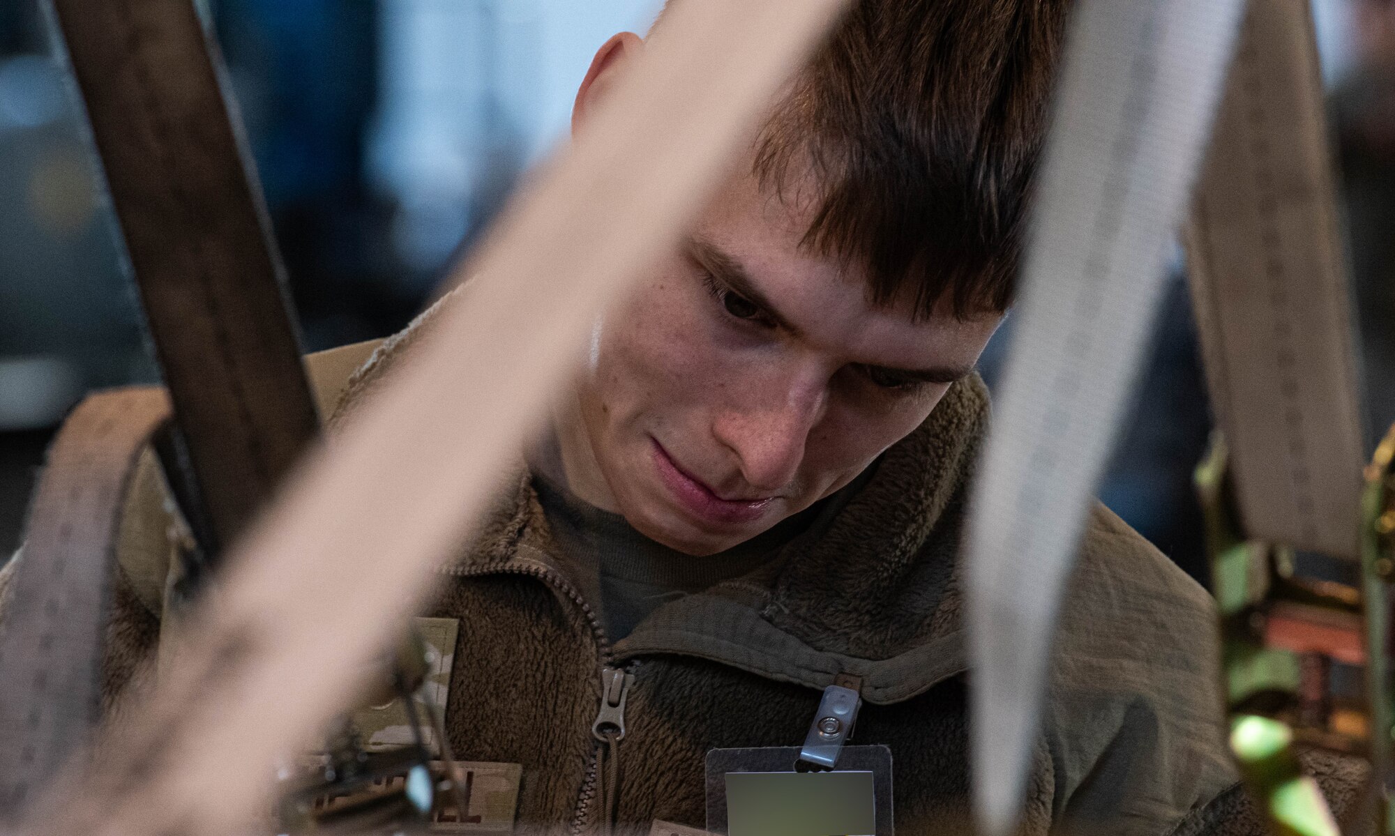 Airman 1st Class Jaxxon Truesdell, 5th Logistics Readiness Squadron outbound cargo technician, inspects cargo during Prairie Vigilance 24-3 at Minot Air Force Base, North Dakota, April 9, 2024. Prairie Vigilance demonstrates the capability, resilience, adaptability, and strength of Team Minot Airmen. (U.S. Air Force photo by Airman 1st Class Kyle Wilson)