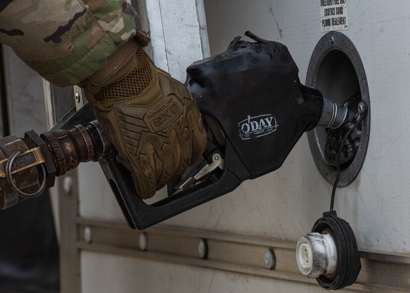 An Airman assigned to the 5th Logistics Readiness Squadron conducts refueling operations during Prairie Vigilance 24-3 at Minot Air Force Base, North Dakota, April 8, 2024. Prairie Vigilance demonstrates the capability, resilience, adaptability, and strength of Team Minot Airmen. (U.S. Air Force photo by Airman 1st Class Kyle Wilson)