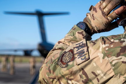 A person stands on the flightline.