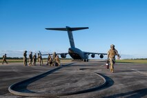 People walk on the flightline.