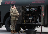 An Airman assigned to the 5th Logistics Readiness Squadron conducts refueling operations during Prairie Vigilance 24-3 at Minot Air Force Base, North Dakota, April 8, 2024. Exercises like Prairie Vigilance continually develop Airmen and aircrew skill sets by improving operational capabilities and increasing mission readiness. (U.S. Air Force photo by Airman 1st Class Kyle Wilson)