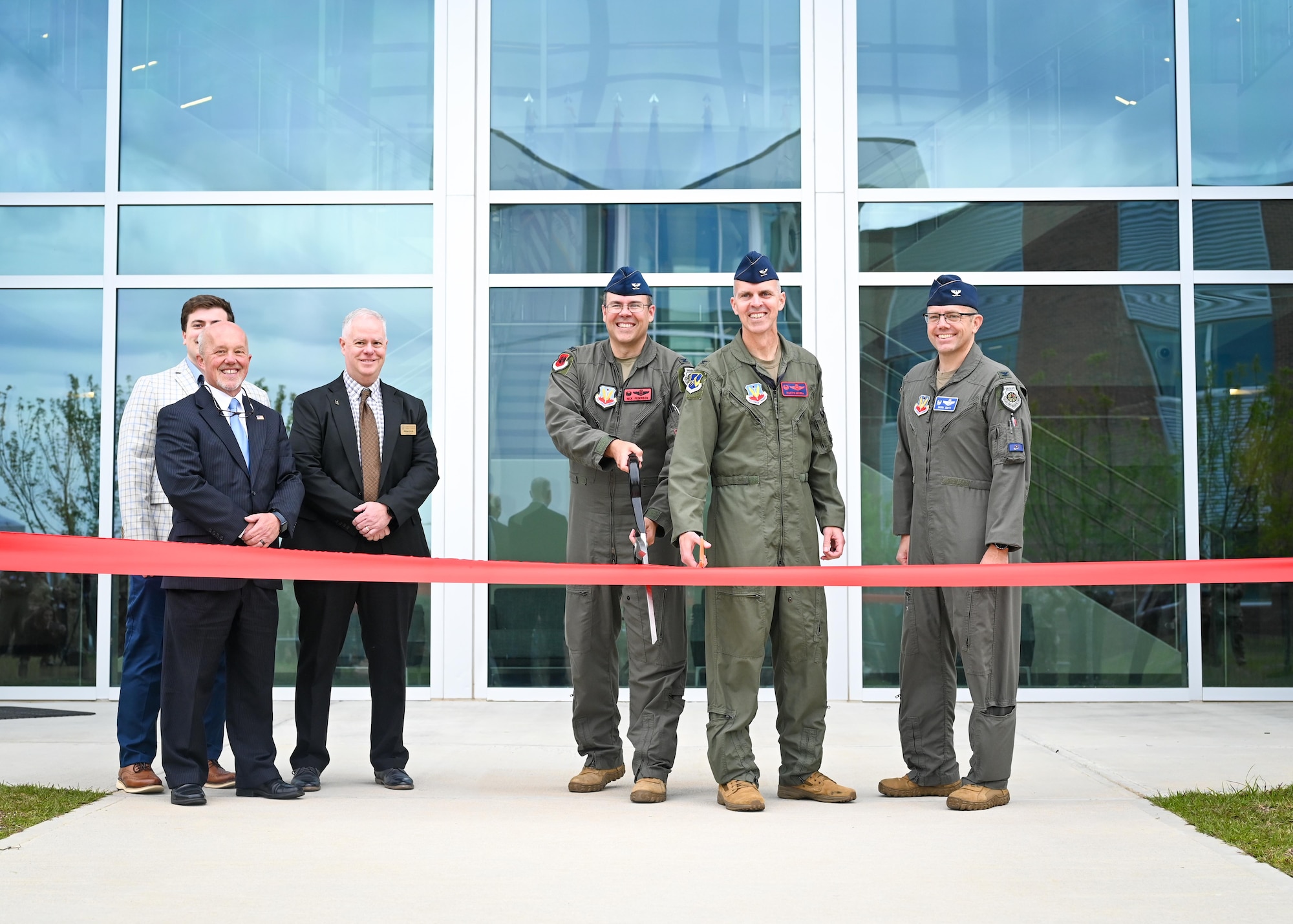 Colonel Pederson and Colonel Merrell cut a ceremonial ribbon.