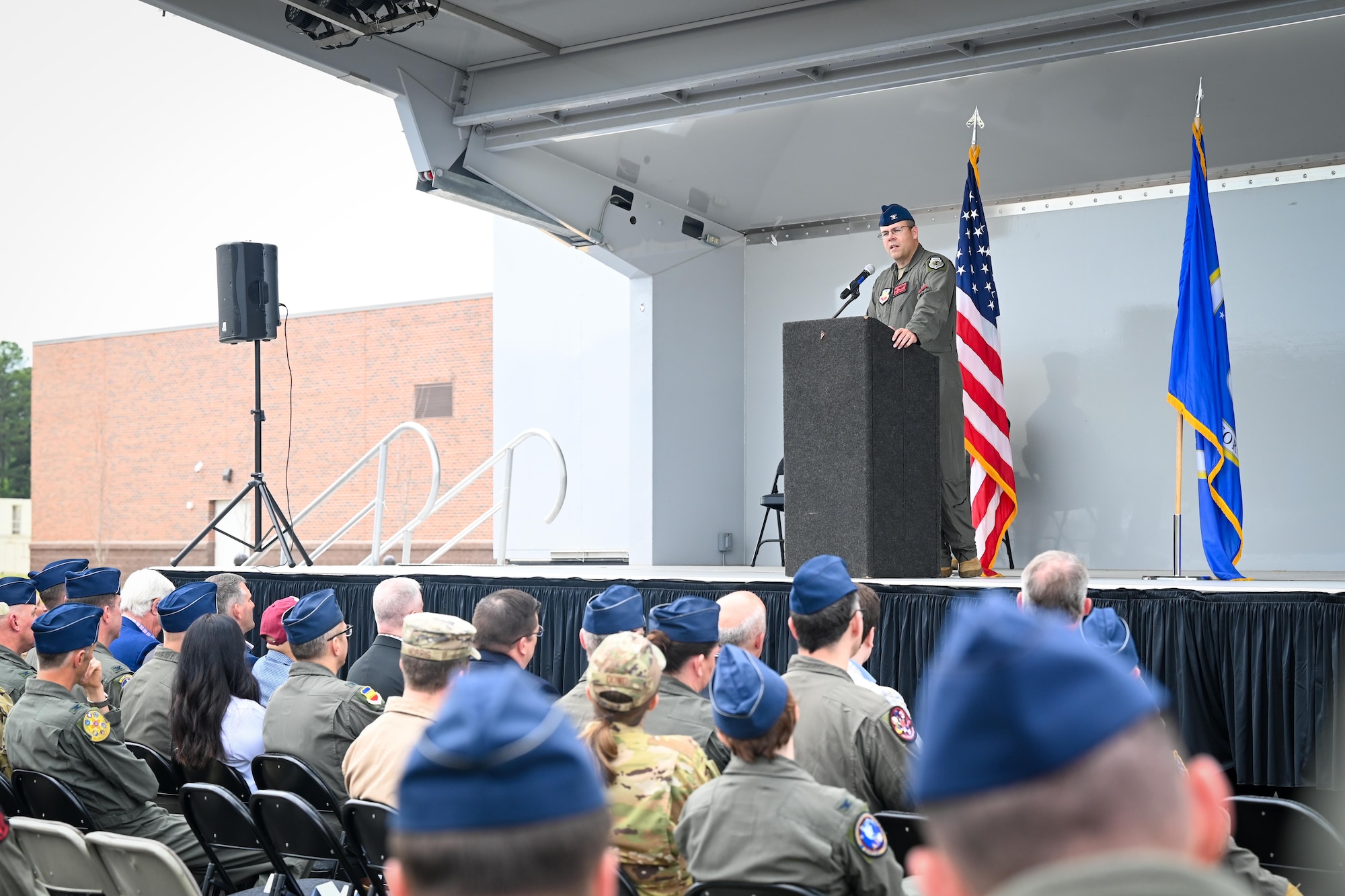 Colonel Pederson delivers a speech to an audience.