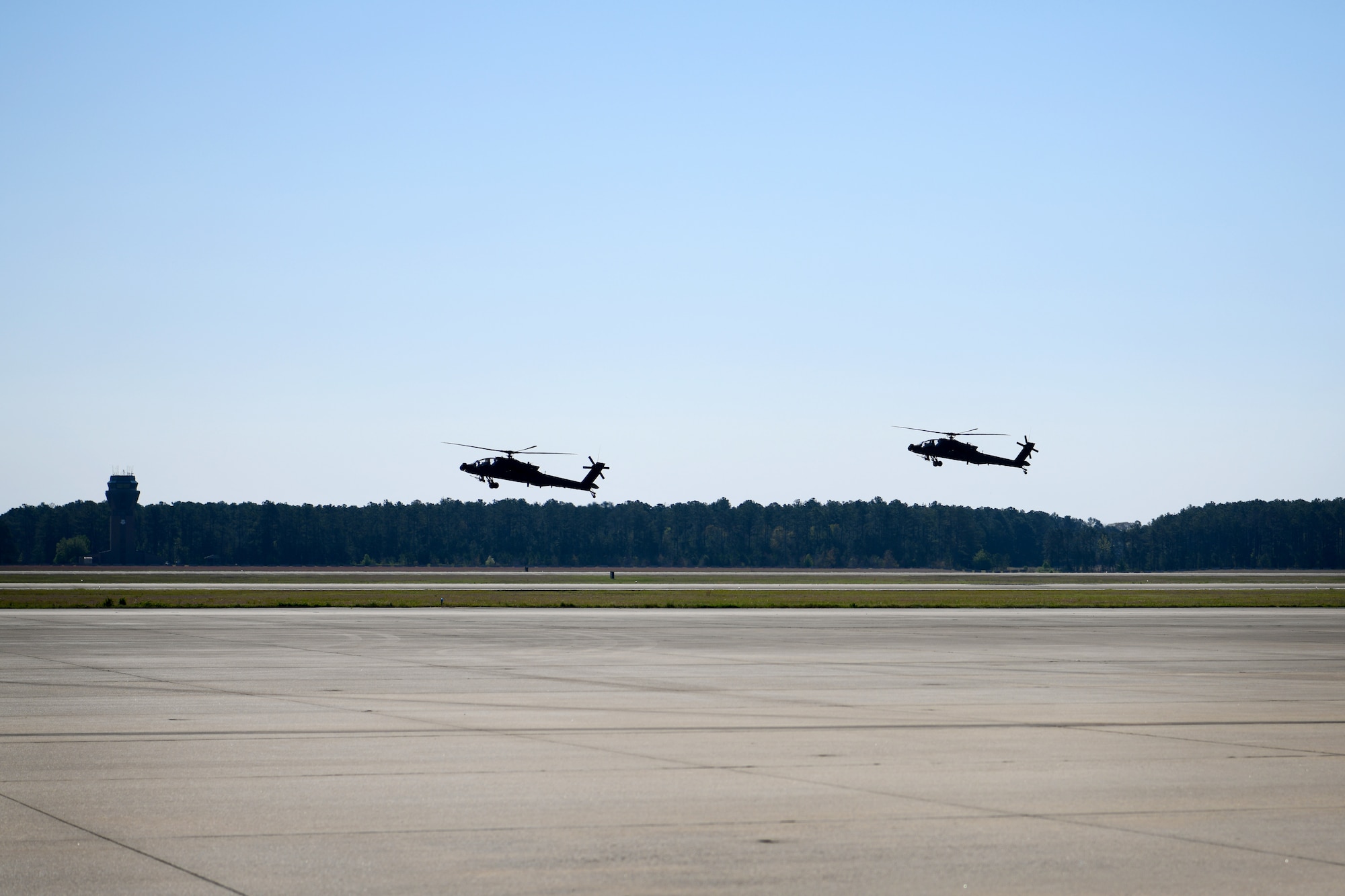 U.S. Army AH-64E Apache Guardian helicopters assigned to the 1-151st Attack Reconnaissance Battalion, South Carolina Army National Guard, land at Shaw Air Force Base, S.C., March 21, 2024. The AH-64Es landed at Shaw AFB prior to a joint forcible entry exercise in which they would be transported by a C-5M Super Galaxy to the training area in Florida. (U.S. Air Force photo by Staff Sgt. Kelsey Owen)