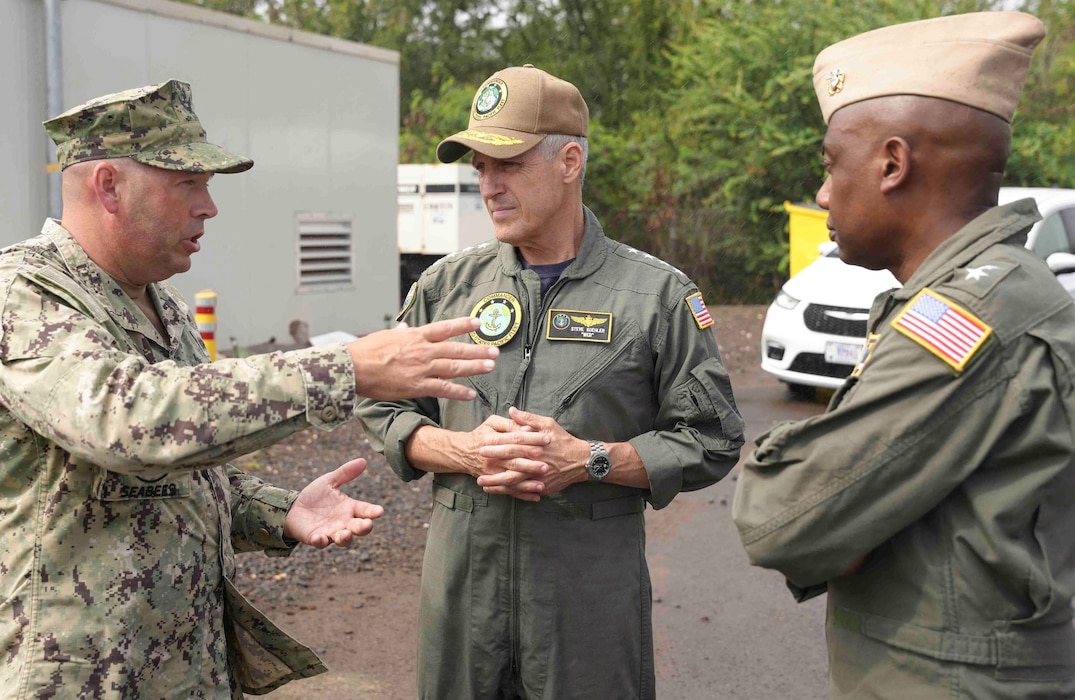 Admiral Stephen Koehler, center, commander, U.S. Pacific Fleet (PACFLT), Capt. James Sullivan, left, deputy commander for remediation and environment, Navy Closure Task Force - Red Hill (NCTF-RH), and Rear Adm. Steve Barnett, commander, NCTF-RH, speak during his first site visit of the Red Hill Bulk Fuel Storage Facility, Halawa, Hawaii, April 5, 2024. Koehler assumed command of PACFLT during a change of command ceremony on Joint Base Pearl Harbor-Hickam, April 4. (U.S. Navy photo by Mass Communication Specialist 1st Class Glenn Slaughter)