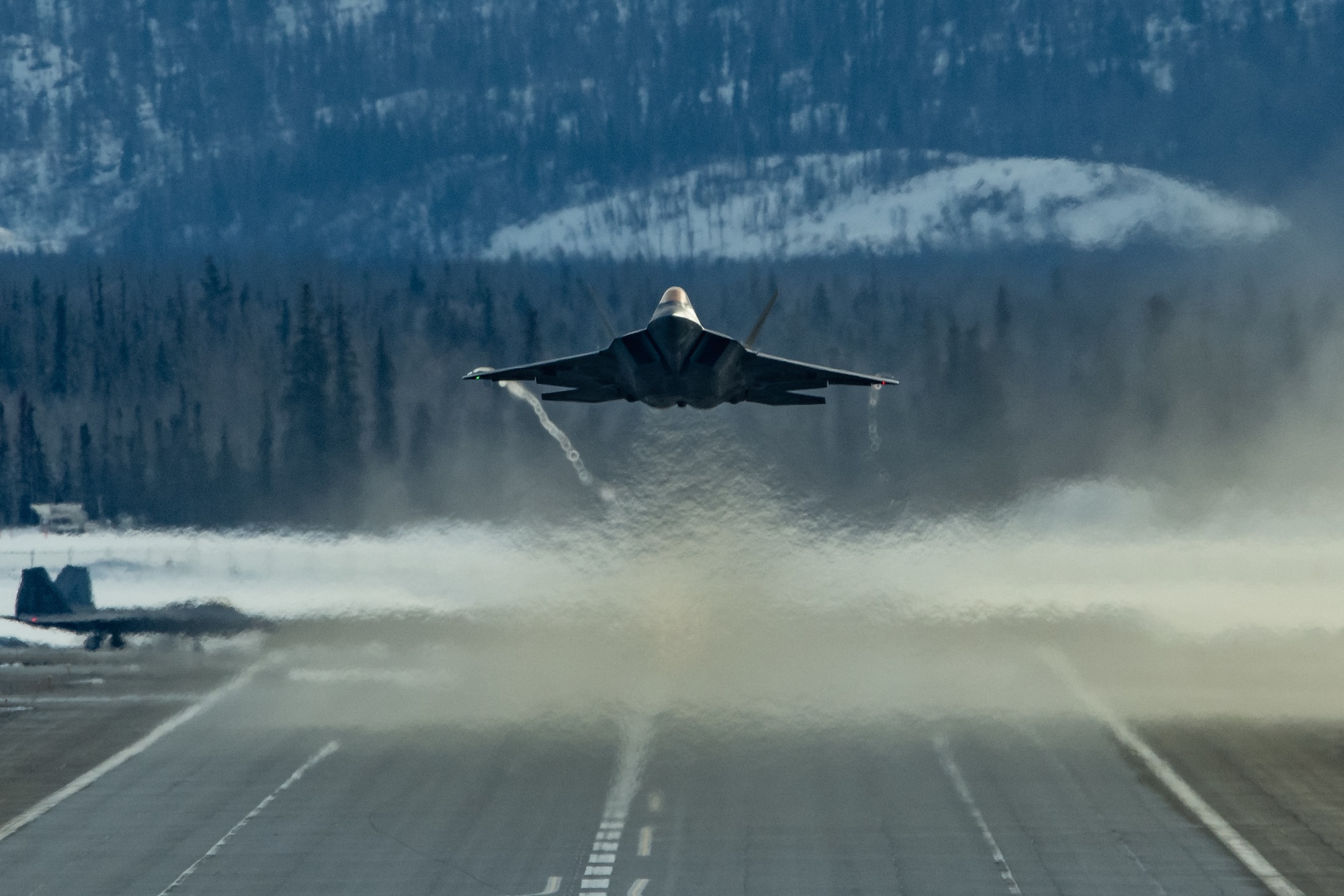 A photo of an F-22 Raptor taking off