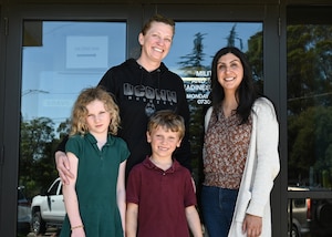 A Military and Family Readiness Center community readiness consultant and a Commander’s Key Support Program Key Support liaison and her family pose for a photo at Vandenberg Space Force Base.