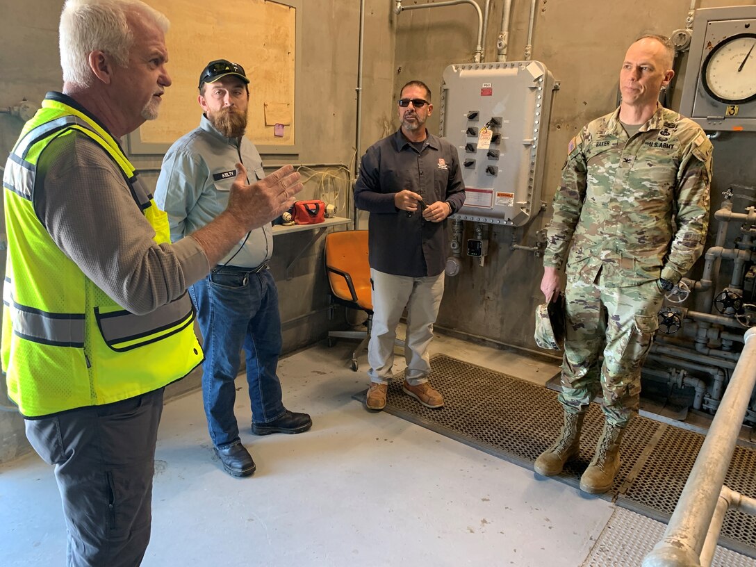 From left to right, Los Angeles District Operations and Maintenance Branch Chief Mike Farris; dam operators River Kelty and Michael Moran; and Los Angeles District Commander Col. Andrew Baker, discuss daily dam operations at Painted Rock Dam March 25 near Gila Bend, Arizona. Painted Rock Dam is a major flood control project in the Gila River Drainage Basin, constructed and operated by the U.S. Army Corps of Engineers.