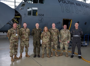 Members of the 126th Air Refueling Wing stand with Polish Air Force counterparts after touring the 33rd Air Base maintenance facility March 25, 2024, in Powidz, Poland. The Illinois Air National Guard wing visited Poland as a part of the State  Partnership Program.