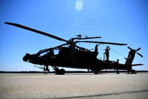 U.S. Soldiers assigned to the 1-151st Attack Reconnaissance Battalion, South Carolina Army National Guard, prepare an AH-64E Apache Guardian for loading onto a U.S. Air Force C-5M Super Galaxy at Shaw Air Force Base, S.C., March 21, 2024. The two-day process was an exercise in coordination and teamwork between the services. (U.S. Air Force photo by Staff Sgt. Kelsey Owen)