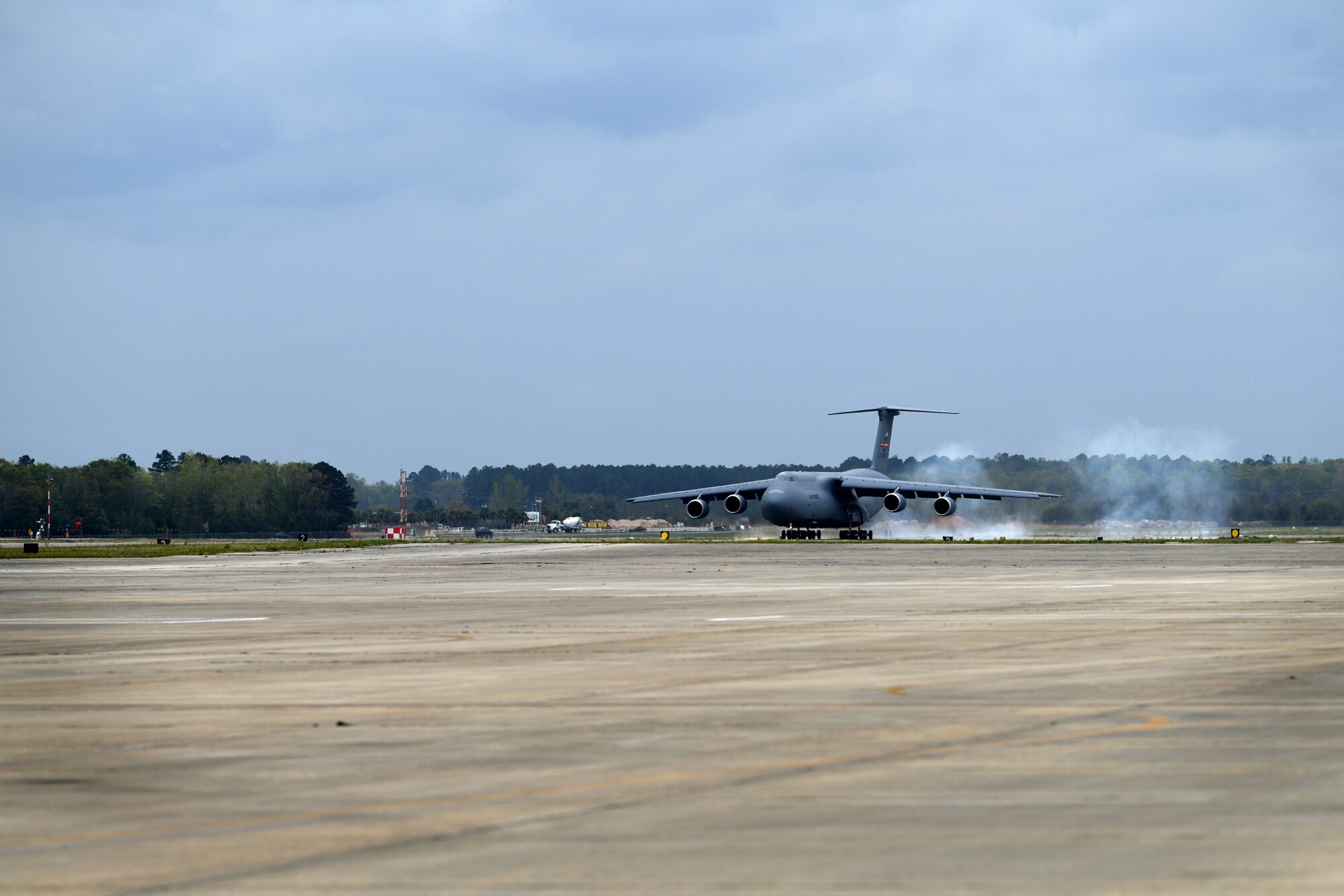 A U.S. Air Force C-5M Super Galaxy assigned to the 337th Airlift Squadron from Westover Air Reserve Base, Mass., lands at Shaw Air Force Base, S.C., March 22, 2024. The C-5M landed at Shaw AFB prior to a joint forcible entry exercise in which they would be transporting two U.S. Army AH-64E Apache Guardian helicopters to the training area in Florida. (U.S. Air Force photo by Staff Sgt. Kelsey Owen)