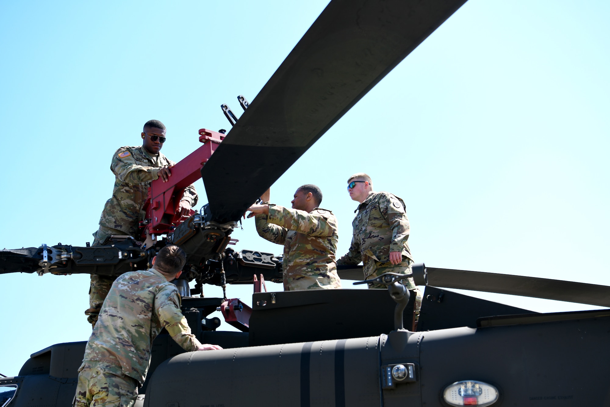 U.S. Soldiers assigned to the 1-151st Attack Reconnaissance Battalion, South Carolina Army National Guard, prepare an AH-64E Apache Guardian for loading onto a U.S. Air Force C-5M Super Galaxy at Shaw Air Force Base, S.C., March 21, 2024. The two-day process marked the first time U.S. Army AH-64Es were loaded into a C-5M at Shaw AFB. (U.S. Air Force photo by Staff Sgt. Kelsey Owen)