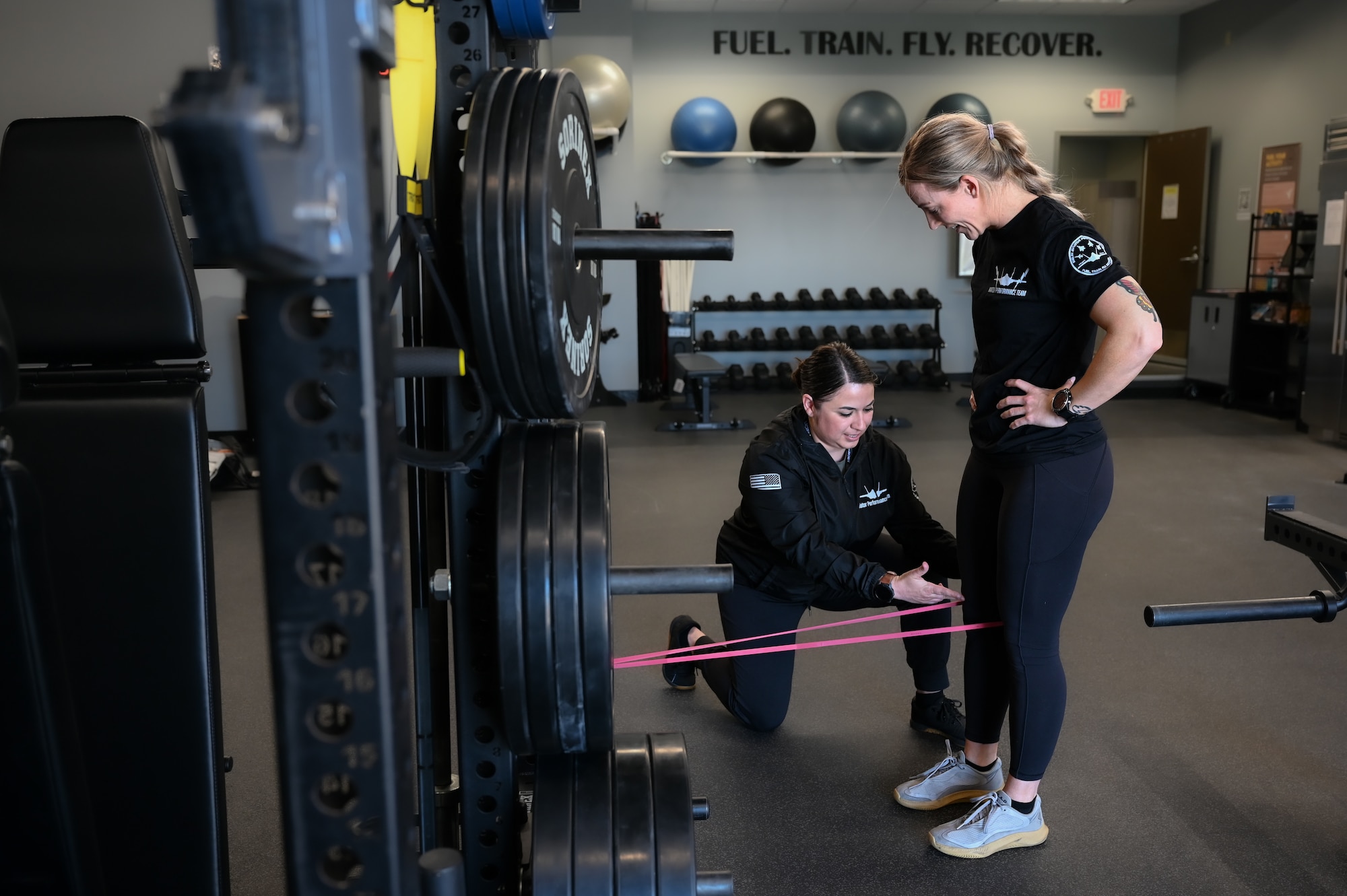 U.S. Air Force Maj. Stephanie Chayrez, the 33rd Fighter Wing Aircrew Performance Team program director, left, guides Maj. Laney Schol, an F-35A Lightning II instructor pilot assigned to the 60th Fighter Squadron, through a warmup at the Aircrew Performance Center at Eglin Air Force Base, Florida, March 27, 2024.