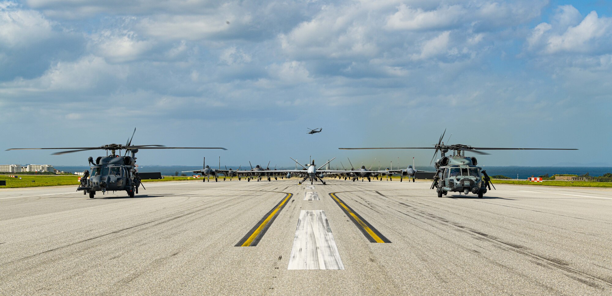 Many aircraft in formation on a runway