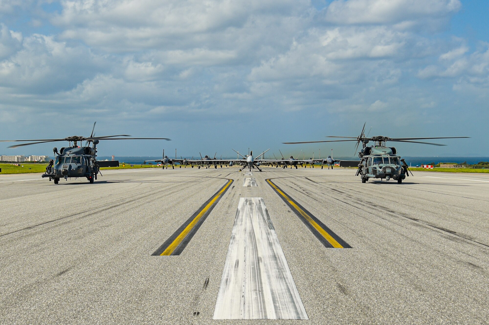 Many aircraft in formation on a runway