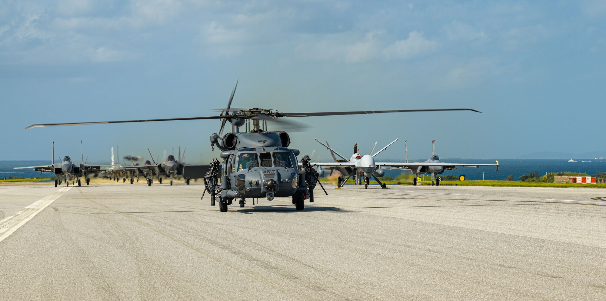 Many aircraft in formation on a runway