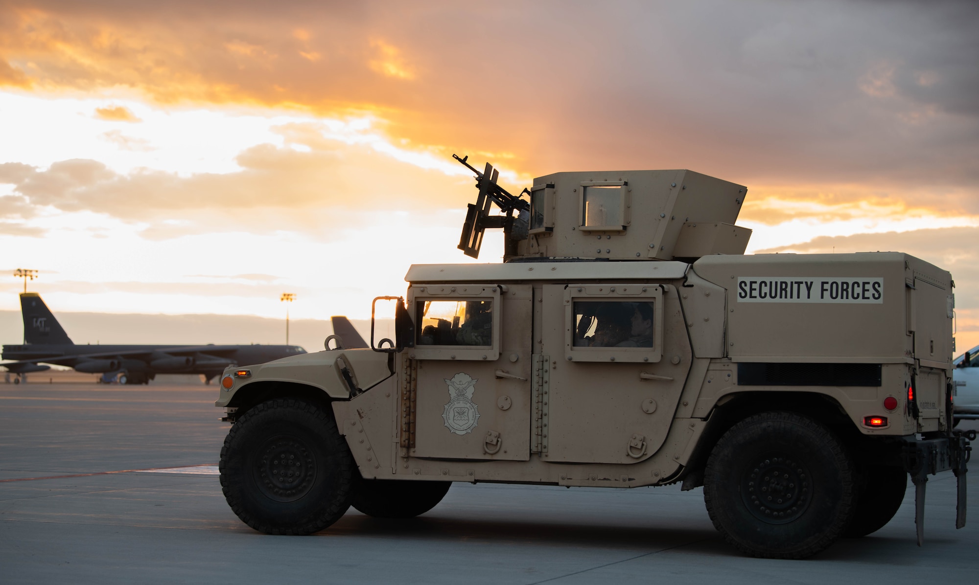 A HUMVEE assigned to the 5th Security Forces Squadron idles on the flight line during Exercise Prairie Vigilance/Bayou Vigilance 24-3 at Minot Air Force Base, North Dakota, April 8, 2024. Minot Air Force Base is committed to its mission of executing nuclear operations and global strike anytime, anywhere, to deter and, if necessary, respond to strategic attack. (U.S. Air Force photo by Airman 1st Class Luis Gomez)