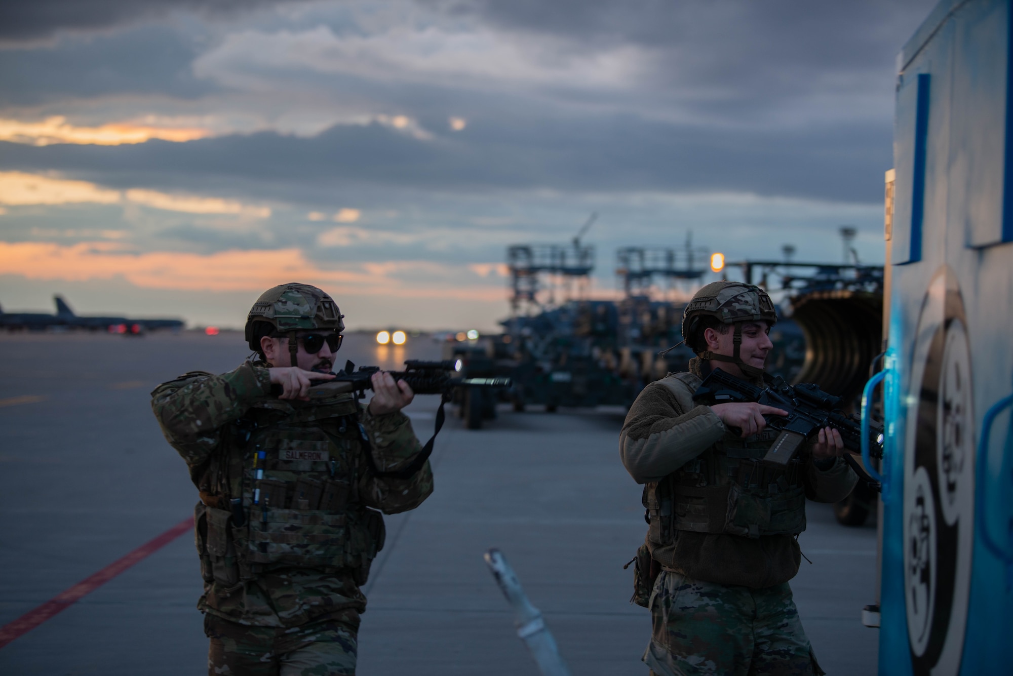 Airman Jonathan Salmeron, 5th Security Forces Squadron defender, (left) and Senior Airman Jose Soiza, 5th Security Forces Squadron defender, complete a security inspection on the flightline in support of Exercise Prairie Vigilance/Bayou Vigilance 24-3 at Minot Air Force Base, North Dakota, April 8, 2024. Exercises like this continually develop Airmen and aircrew skill sets by improving operational capabilities and increasing mission readiness. (U.S. Air Force photo by Airman 1st Class Luis Gomez)