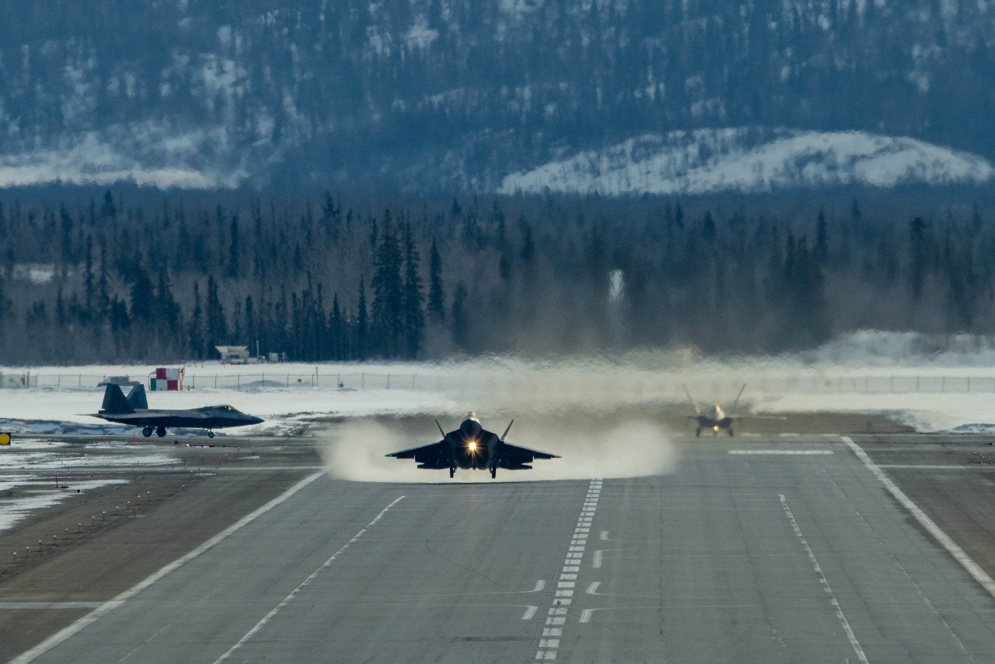 A photo of an F-22 Raptor taking off