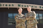 U.S. Air Force Staff Sgt. Sarah Gerry (left), an armament systems loader at the 158th Fighter Wing, and her sister, U.S. Air Force Senior Airman Laura Gerry, a munitions systems storage handler at the 158th Fighter Wing, stand together for a photo at the Vermont Air National Guard Base, South Burlington, Vermont, April 8, 2024. On April 29, 2022 the Gerry sisters deployed together for the first time to Europe in support of the NATO air policing mission.