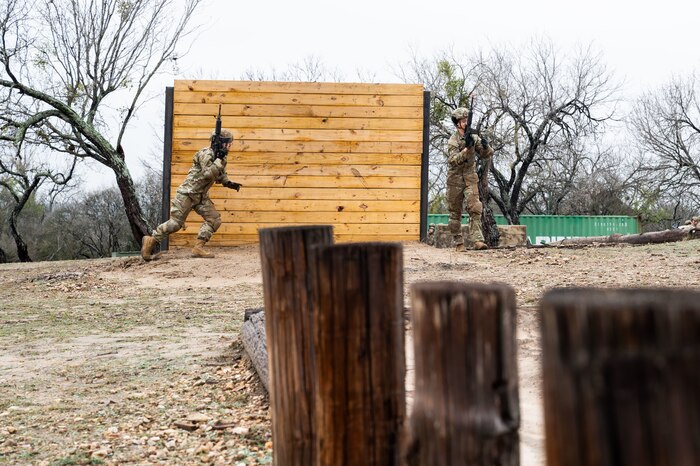 A Security Forces Technical Training student runs during training at Joint Base San Antoino-Chapman Annex, Texas, Jan. 22, 2024. The 343rd Training Squadron is optimizing training to ensure Defenders are equipped with the skills and knowledge needed to tackle evolving threats in a modern era. The 343 TRS Security Forces technical training is one of the key components in the Defender Next initiative, where the career field is undertaking the largest shift in the schoolhouse in over two decades.  (U.S. Air Force photo by Vanessa R. Adame)