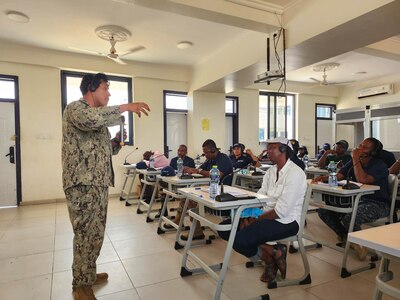 U.S. Navy Hospital Corpsman 1st Class Marcos Ramirez, assigned to Naval Mobile Construction Battalion (NMCB) 11, teaches first-aid skills to fisheries inspectors onboard the Ghana Naval Training Command in Nutekpor-Sogakope in the Volta Region of Ghana, Feb. 26, 2024. The training was held as part of a Visit, Board, Search and Seizure (VBSS) course led by the United Nations Office of Drugs and Crime (UNODC) Global Maritime Crime Programme (GMCP). NMCB 11, assigned to the TWENTY SECOND Naval Construction Regiment, is forward deployed across the U.S. Naval Forces Europe-Africa area of operations, in support of U.S. Sixth Fleet maritime operations to defend U.S., allied, and partner interests. (Courtesy Photo)