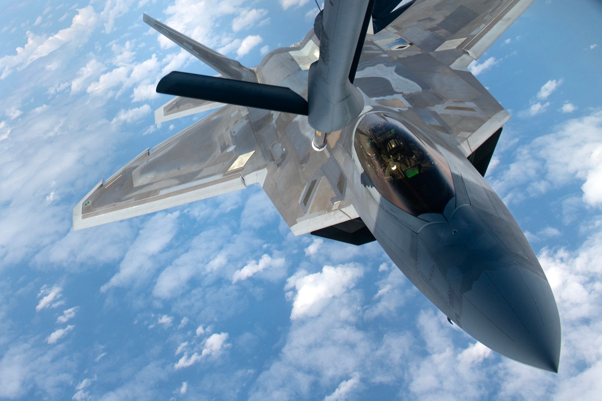 An F-22A Raptor assigned to the 19th Fighter Squadron, Joint Base Pearl Harbor–Hickam, Hawaii, approaches a 909th Air Refueling Squadron KC-135 Stratotanker for aerial refueling during a large force exercise over the Pacific Ocean, April 10, 2024. Aerial refueling capabilities are vital for sustaining long range counter air operations in defense of the Indo-Pacific theater. (U.S. Air Force photo by Staff Sgt. Jessi Roth)