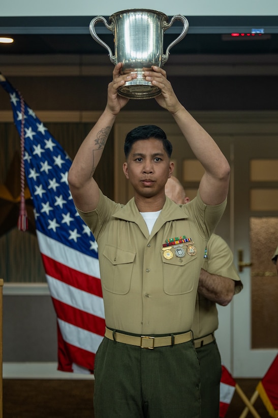 U.S. Marine Corps Staff Sgt. Christian Cachola, with the Marine Corps Shooting Team, receives the first-place award for the 2024 rifle match during the 2024 Marine Corps Rifle and Pistol Championship Awards Ceremony at The Clubs at Quantico on Marine Corps Base Quantico, Virginia, April 9, 2024. Marines who demonstrate maturity, professionalism, and exceptional marksmanship talent at the Marine Corps Championships will receive an invitation from the team captain of the MCST to serve as a summer augment. Summer augments to the MCST will further compete in state, regional, national, and inter-service matches. (U.S. Marine Corps photo by Lance Cpl. Ethan Miller)
