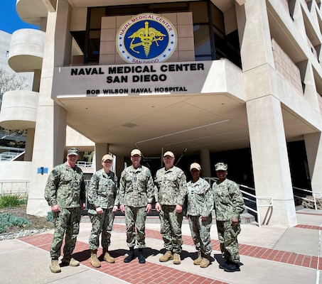 SAN DIEGO (April 10, 2024) Navy Judge Advocate General Vice Adm. Darse E. "Del" Crandall Jr., third from left, visited Defense Health Agency (DHA) and Navy legal staff at Naval Medical Center San Diego (NMCSD) to express his appreciation for their collective efforts and the legal services they provide, 10 April 2024.  Crandall is the 45th Navy Judge Advocate General (JAG) and serves as the principal military legal counsel to the Secretary of the Navy and Chief of Naval Operations. He also leads the more than 2,500 attorneys, enlisted legalmen, and civilian employees of the worldwide Navy JAG Corps community.  The mission of NMCSD is to prepare service members to deploy in support of operational forces, deliver high quality health care services, and shape the future of military medicine through education, training, and research. NMCSD employs more than 5,000 active-duty military personnel, civilians and contractors in southern California to provide patients with world-class care. Anchored in Excellence, Committed to Health!