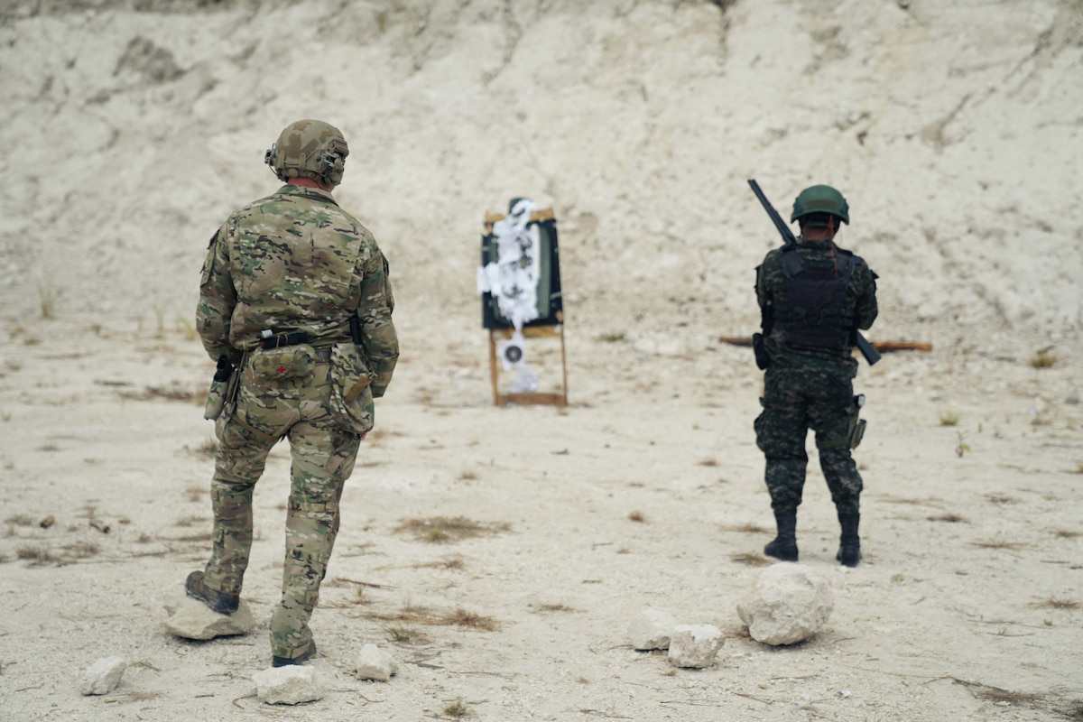 A member of 7th Special Forces Group (Airborne) leads gun range training with a member of the Honduran military in La Venta, Honduras, as part of CENTAM Guardian 24, April 5, 2024.