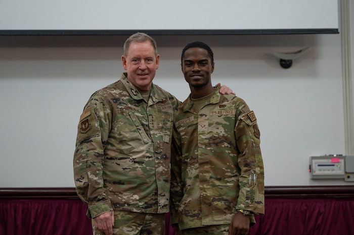 Airmen pose for a photo.