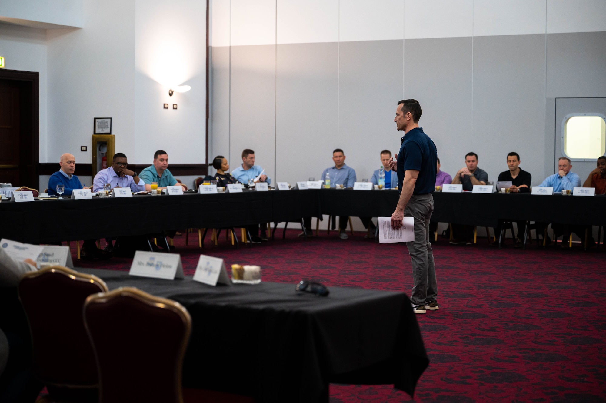 An Airman speaks at a conference.
