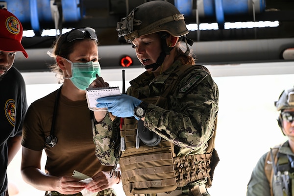 Lt. Rebecca Smith, assigned to ERCS Bravo, gives report on a simulated patient to providers as part of the initial course implementation of En-route Care System (ECRS) as part of the Navy's Expeditionary Medicine System (EXMED), March 16. ERCS is one of the Navy’s expeditionary medicine capabilities that provides a ready, rapidly deployable and combat effective medical forces to improve survivability across the full spectrum of care, regardless of environment. and revised provides uninterrupted care during patient movement from the point of injury (POI) through Role 4 care without clinically compromising the patients’ condition. The Navy Medicine Operational Training Command (NMOTC) is the Navy’s leader in operational medicine and trains specialty providers for aviation, surface, submarine, expeditionary, and special operations communities. (U.S. Navy photo by Mass Communication Specialist 1st Class Russell Lindsey SW/AW)