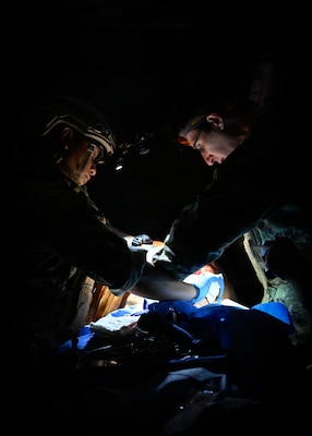 Hospital Corpsman 1st Class Kelvin Cabacungan and LCDR Conor Hymes, assigned to Emergency Resuscitative Surgical System (ERSS) Bravo perform surgery on  on a simulated a high fidelity manikin trainer as part of an Operational Readiness Evaluation (ORE) of Navy EXMED capabilities at Naval Expeditionary Medical Training Institute (NEMTI), March 17. The trainer is a lifelike medical training tool that can breathe, bleed, and react physiologically like a real patient. ERSS, and ERCS are components of Navy’s expeditionary medicine capabilities that provide a ready, rapidly deployable and combat effective medical force to improve survivability across the full spectrum of care, regardless of environment. and provides targeted lifesaving interventions to patients onboard platforms and in austere environments without clinically compromising the patients’ condition. The Navy Medicine Operational Training Command (NMOTC) is the Navy’s leader in operational medicine and trains specialty providers for aviation, surface, submarine, expeditionary, and special operations communities. (U.S. Navy photo by Mass Communication Specialist 1st Class Russell Lindsey SW/AW)