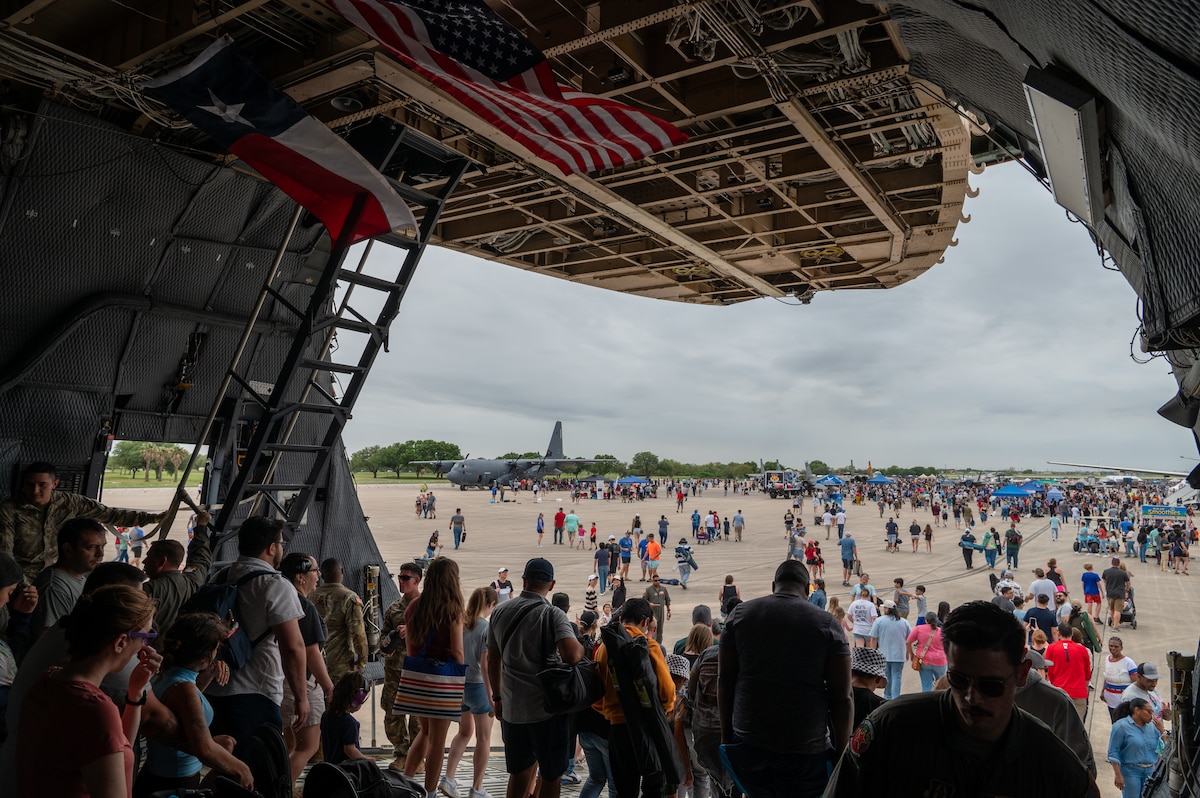 The Great Texas Airshow attendees walk out of the 433rd Airlift Wing’s C-5M Super Galaxy near the entrance of the airshow at Joint Base San Antonio-Randolph, Texas Apr. 7, 2024.