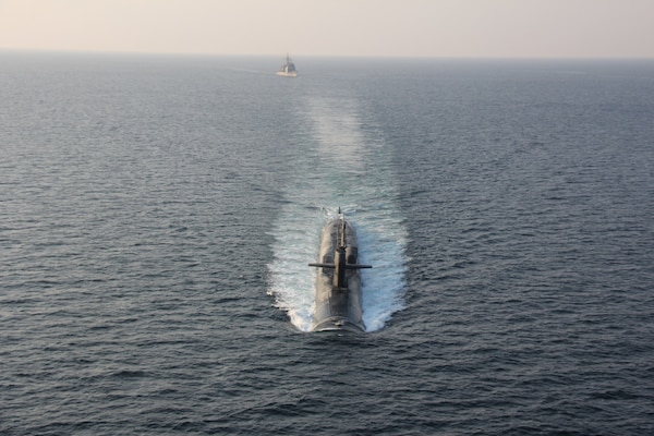 STRAIT OF HORMUZ (Dec. 21, 2020) - The guided-missile submarine USS Georgia (SSGN 729), front, transits the Strait of Hormuz with the guided-missile cruisers USS Philippine Sea (CG 58) and USS Port Royal (CG 73), not pictured, Dec. 21.