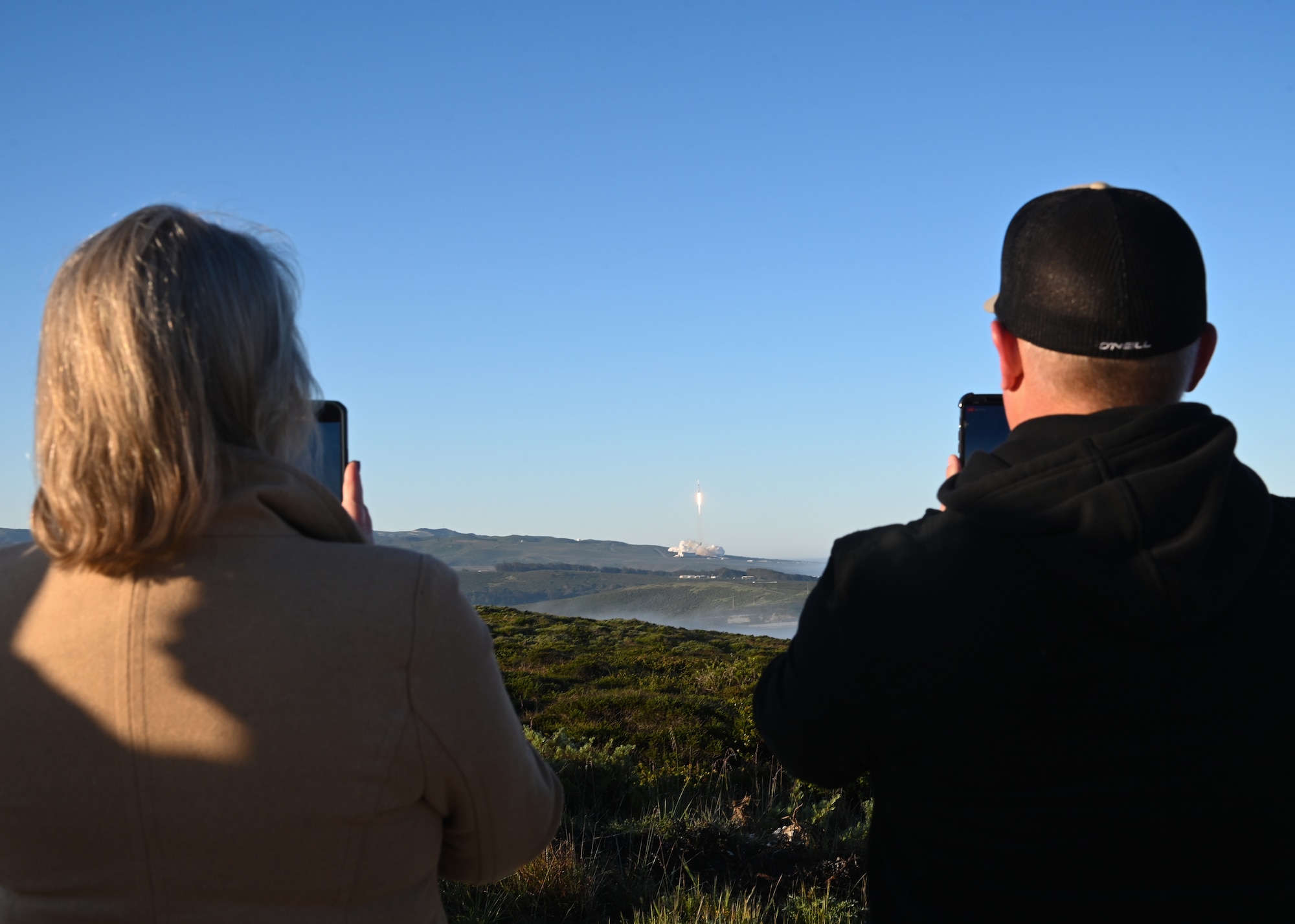 people watch as ussf-62 launches from vsfb