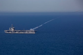 USS Abraham Lincoln (CVN 72) fires a RIM-116 missile.