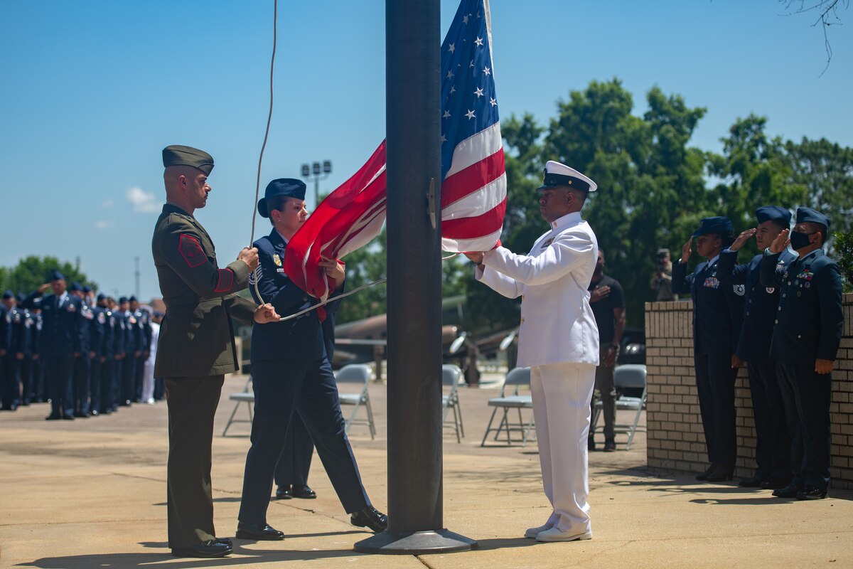 Graduates with Class 21-E lower the flag during a retreat ceremony after their graduation from the Senior Noncommissioned Officer Academy on Maxwell-Gunter Annex, Ala. All students attending the Air Force SNCOA on or after Oct. 1, 2024, will be required to complete the Enlisted Joint Professional Military Education II online course prior to attendance. (U.S. Air Force photo by Airman 1st Class Jackson Manske)