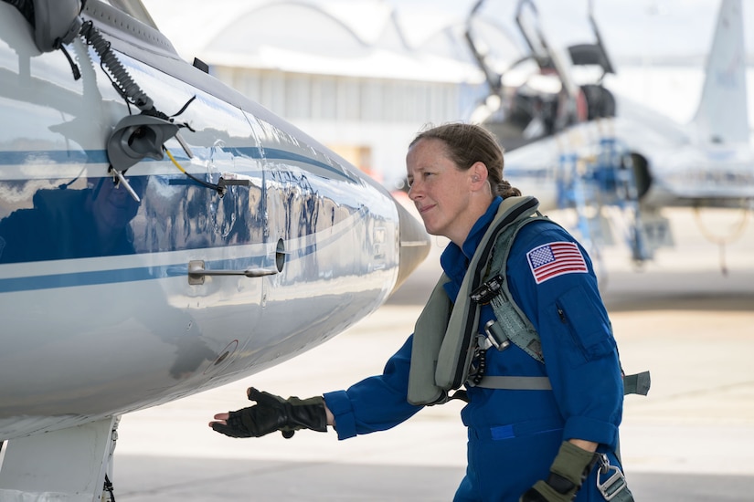 A pilot inspects an aircraft.