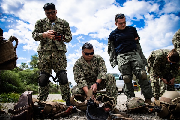 Students of  Navy Medicine's first integrated implementation of En-route Care System (ERCS) and Emergency Resuscitative Surgical System (ERSS) courses don their protective armor kits before undergoing patrol training, March 13. ERCS and ERSS are components of the Navy’s expeditionary medicine (EXMED) system which provide a ready, rapidly deployable and combat effective medical forces to improve survivability across the full spectrum of care, regardless of environment. and provides uninterrupted care during patient movement from the point of injury (POI), implementation of life-saving interventions, and through Role 4 care without clinically compromising the patients’ condition. The Navy Medicine Operational Training Command (NMOTC) is the Navy’s leader in operational medicine and trains specialty providers for aviation, surface, submarine, expeditionary, and special operations communities. (U.S. Navy photo by Mass Communication Specialist 1st Class Russell Lindsey SW/AW)