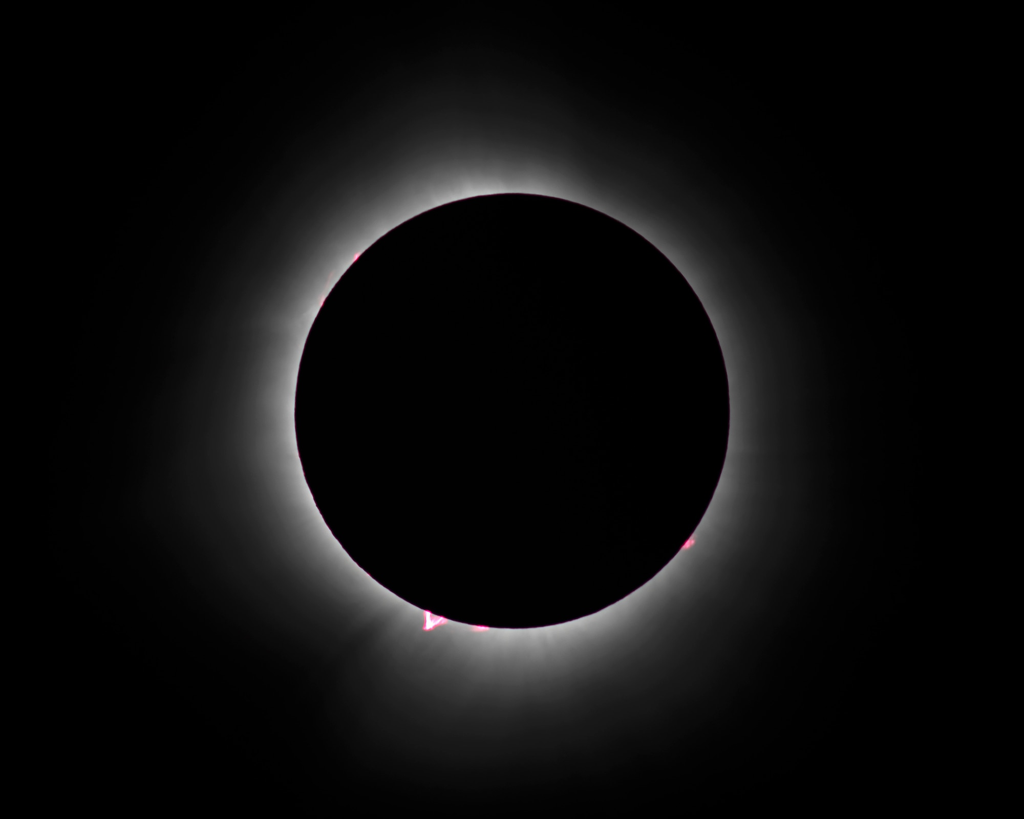 The black disc of the moon surrounded by the sun's corona.
