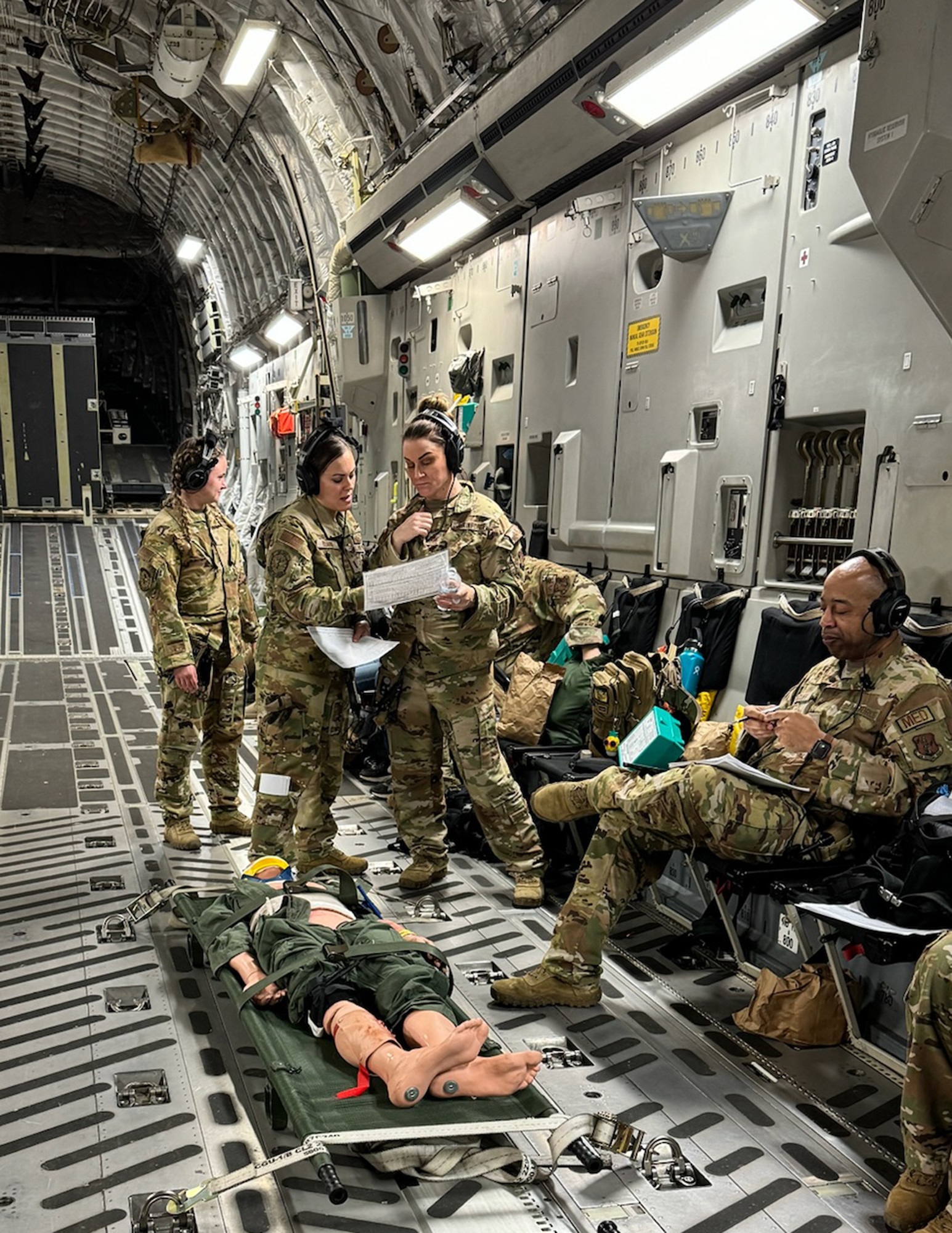 U.S. Air Force Airmen from the 109th Aeromedical Evacuation Squadron reviewed simulated patients' paperwork over the skies of Mississippi on March 11, 2024.
