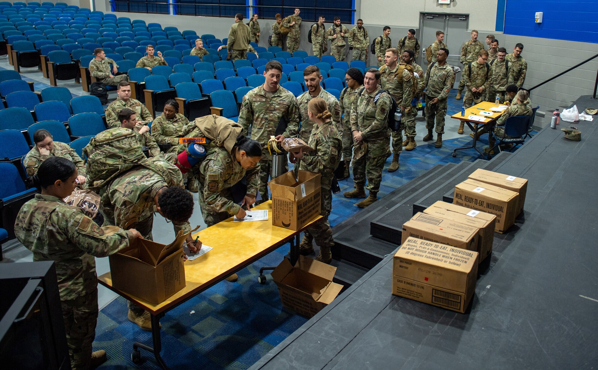 U.S. Air Force Airmen assigned to the 23rd Wing pick up their Meals Ready-to-Eat in preparation for Exercise Ready Tiger 24-1 at Moody Air Force Base, Georgia, April. 8, 2024. The Airmen preparing to leave were issued two MREs before they departed Moody AFB. (U.S. Air Force photo by Airman Cade Ellis)