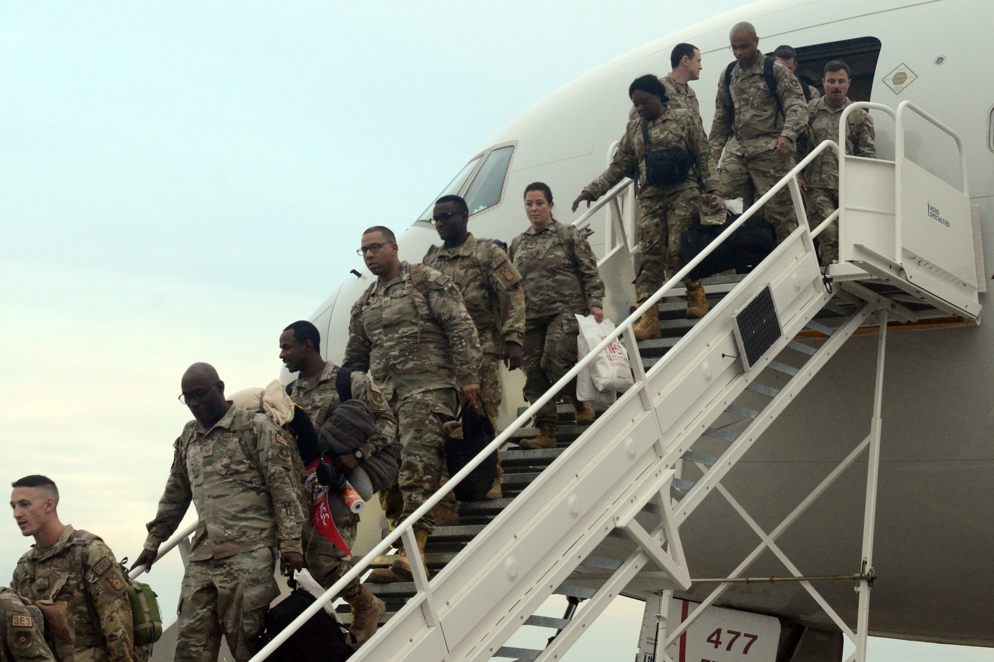 U.S. Airmen assigned to the 169th Fighter Wing, South Carolina Air National Guard, are greeted by family and wing personnel as they return from a six-month deployment to the U.S. Central Command area of responsibility, April 10, 2024. Approximately 150 Swamp Fox Airmen deployed in support of 9th Air Force (Air Forces Central) to the U.S. Central Command area of responsibility, the unit’s first deployment as an expeditionary air base team under the new Air Force Force Generation model. (U.S. Air National Guard photo by Capt. Lisa Allen)