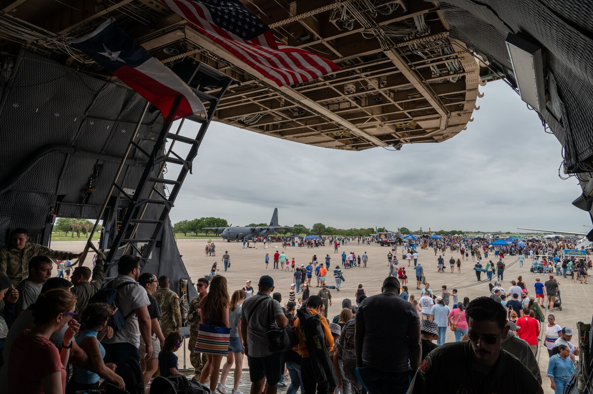 The Great Texas Airshow attendees walk out of the 433rd Airlift Wing’s C-5M Super Galaxy near the entrance of the airshow at Joint Base San Antonio-Randolph, Texas Apr. 7, 2024.